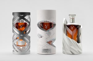 Three bottles of whisky in sculptural decanters