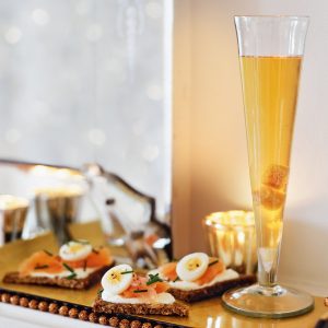Champagne cocktail and snacks on a tray