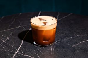 coffee cocktail in small glass on a bar
