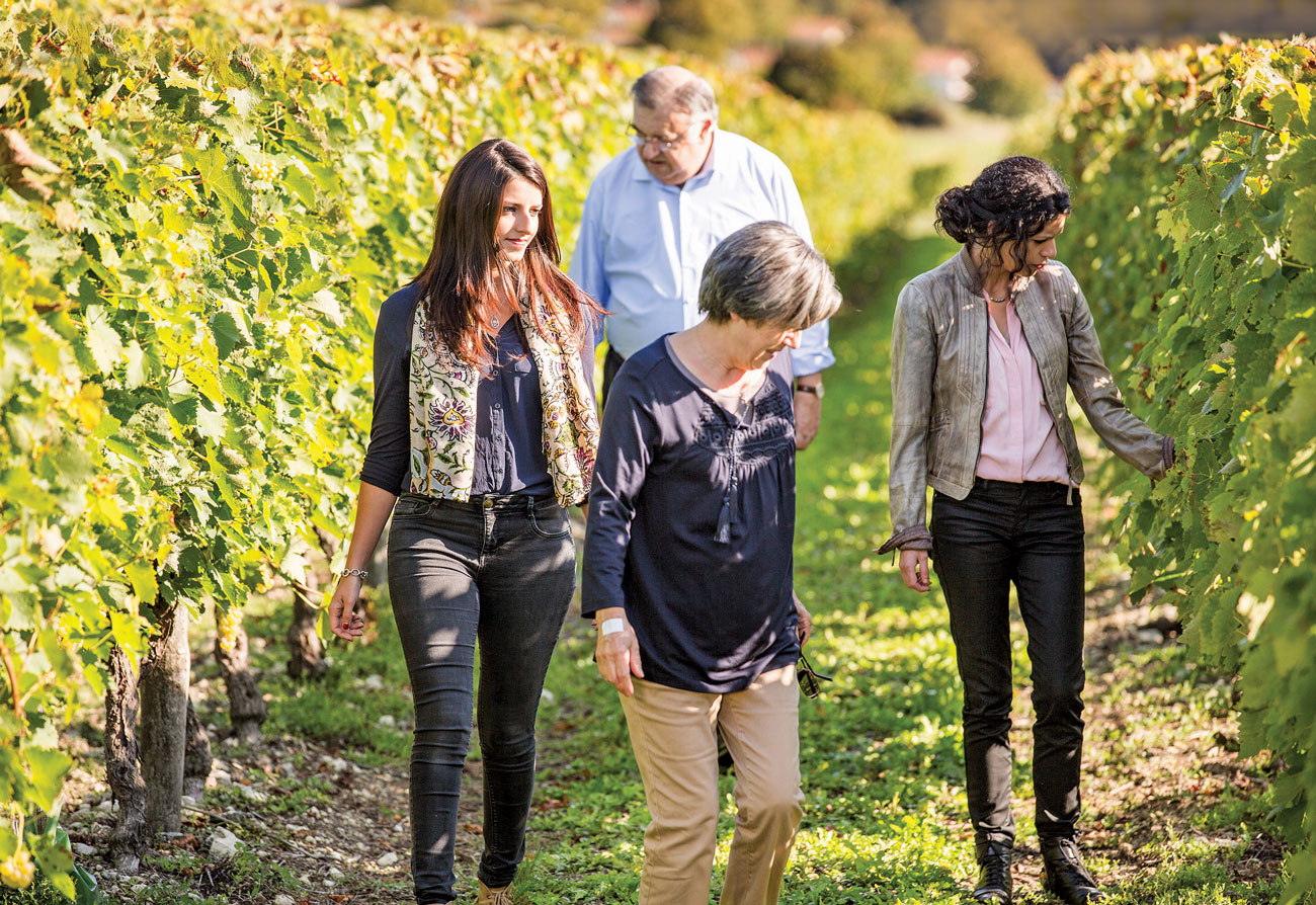 Pauline Trijol and others in vineyard