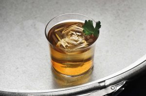A cocktail on a steel tabletop
