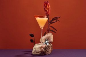 cocktail on a stone with flowers