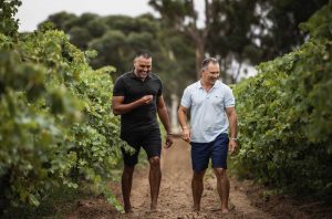 Pauly Vandenbergh (left) and Damien Smith in a vineyard