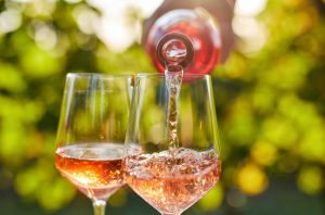 Pouring rose wine from a bottle