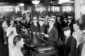 The interior of a crowded New York City bar moments before midnight on 30 June 1919, when Prohibition came into effect