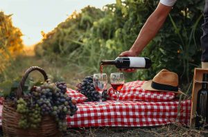 wine and grapes on table