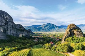 The breathtaking mountain formations of Meteora with the sheltered vineyard of Theopetra in the foreground