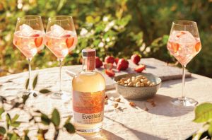 Bottle of Everleaf and glasses on table in outdoor setting