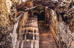 Wine barrels in an underground cellar