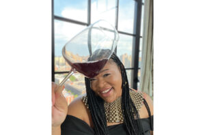 Image of Ikimi Dubose-Woodson with wine glass.