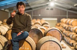 A man sits on mizanura oak barrels