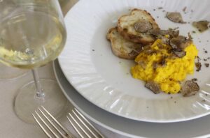 Truffle with eggs and glass of wine