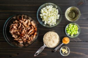 mushroom risotto ingredients: mushrooms, onions, rice, celery, garlic and wine