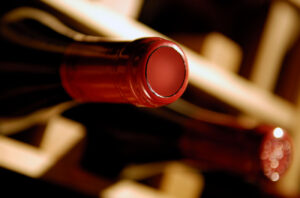 close up of bottles of wine on shelf